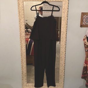 Black spaghetti strap jumpsuit. Never been worn.